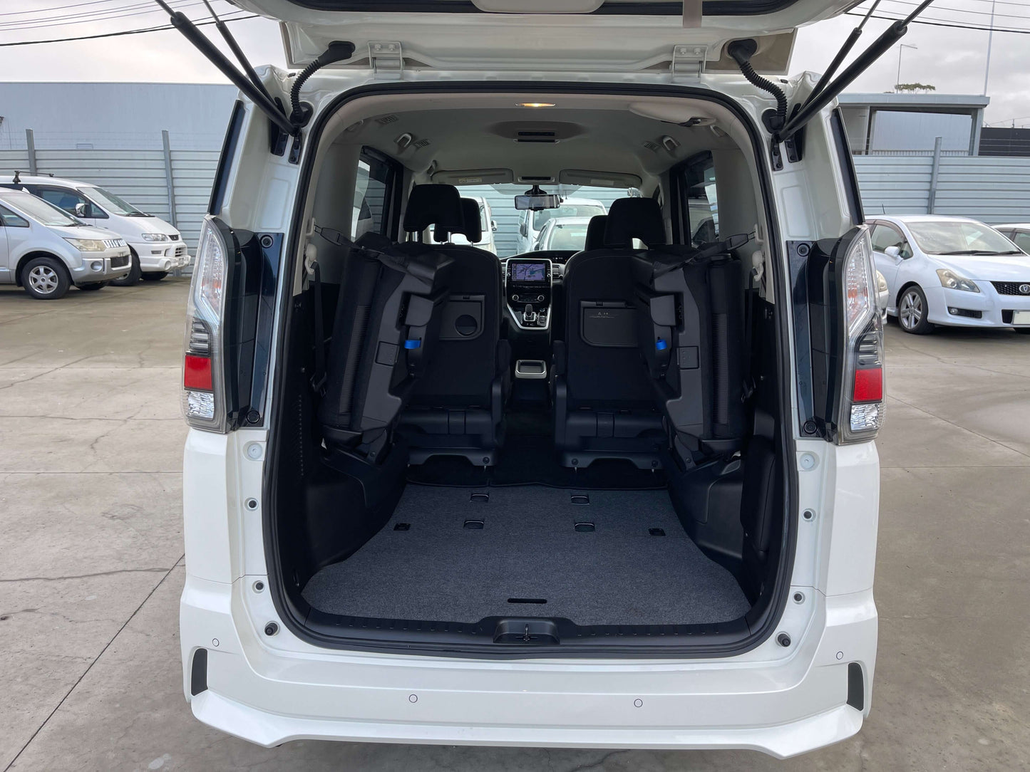 Interior view of the 2018 Nissan Serena 1.2 e-Power Highway Star V with rear seats folded for storage.