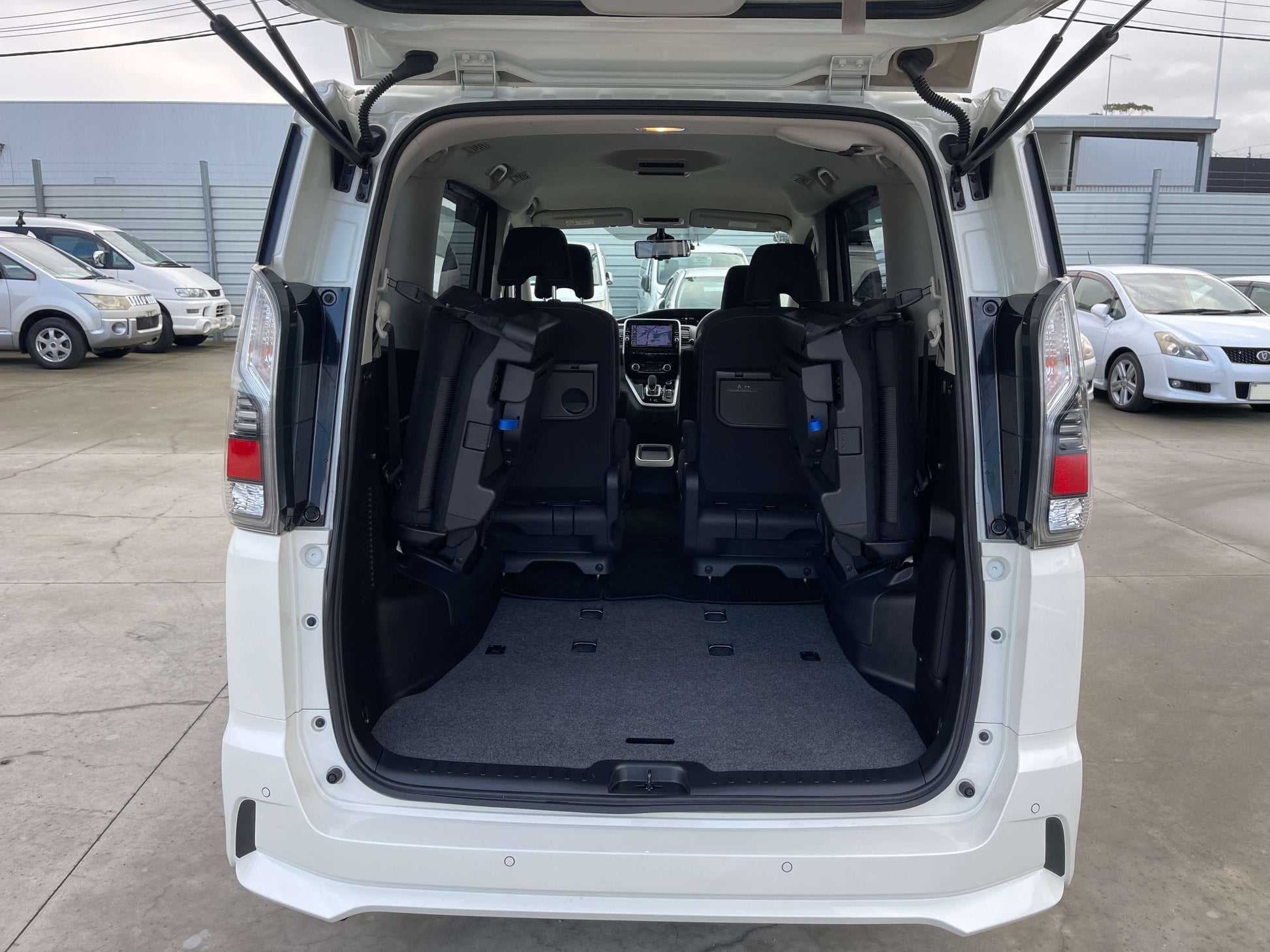 Interior view of the 2018 Nissan Serena 1.2 e-Power Highway Star V with rear seats folded for storage.