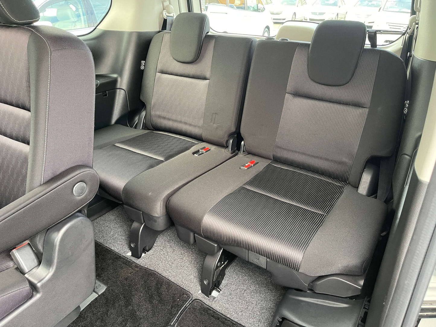 Interior view of the back seats in a 2018 Nissan Serena 1.2 e-Power Highway Star V, featuring 7 seating capacity.