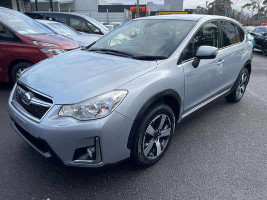 2016 Subaru XV Hybrid 2.0i-L EyeSight 4WD in silver color parked at a dealership.