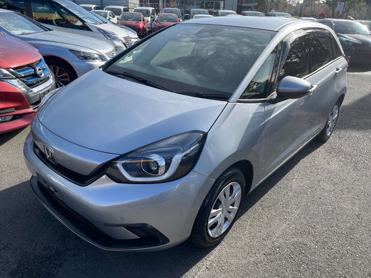 2020 Honda Fit 1.5 eHEV Home Edition in silver, showcasing its modern design and hatchback style, ideal for city driving.