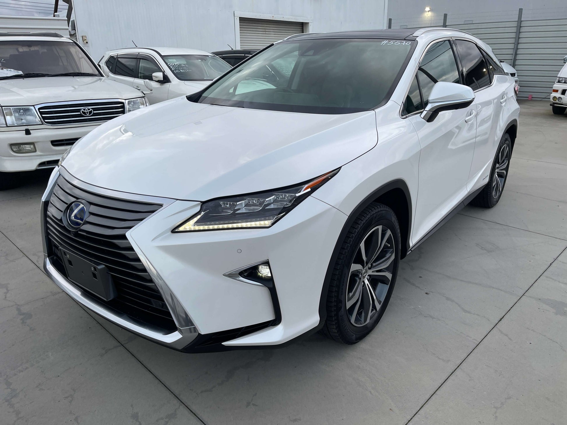 2017 Lexus RX450H V6 3.5L Hybrid L Version Luxury SUV in white with modern design and sleek lines.