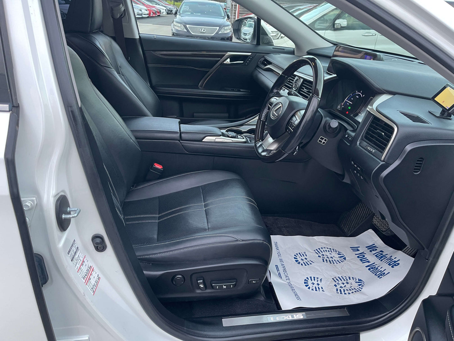 Interior view of a 2017 Lexus RX450H V6 3.5L Hybrid L Version Luxury SUV with leather seats and modern dashboard.