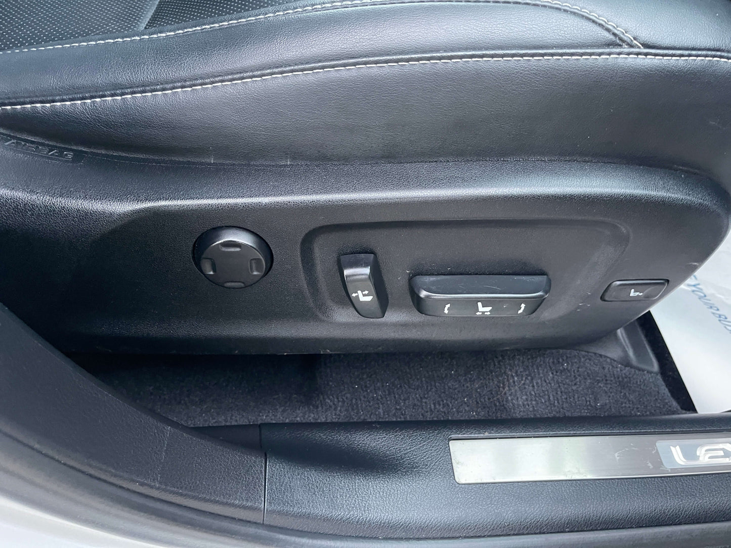 2017 Lexus RX450H power seat controls in luxury SUV driver's side