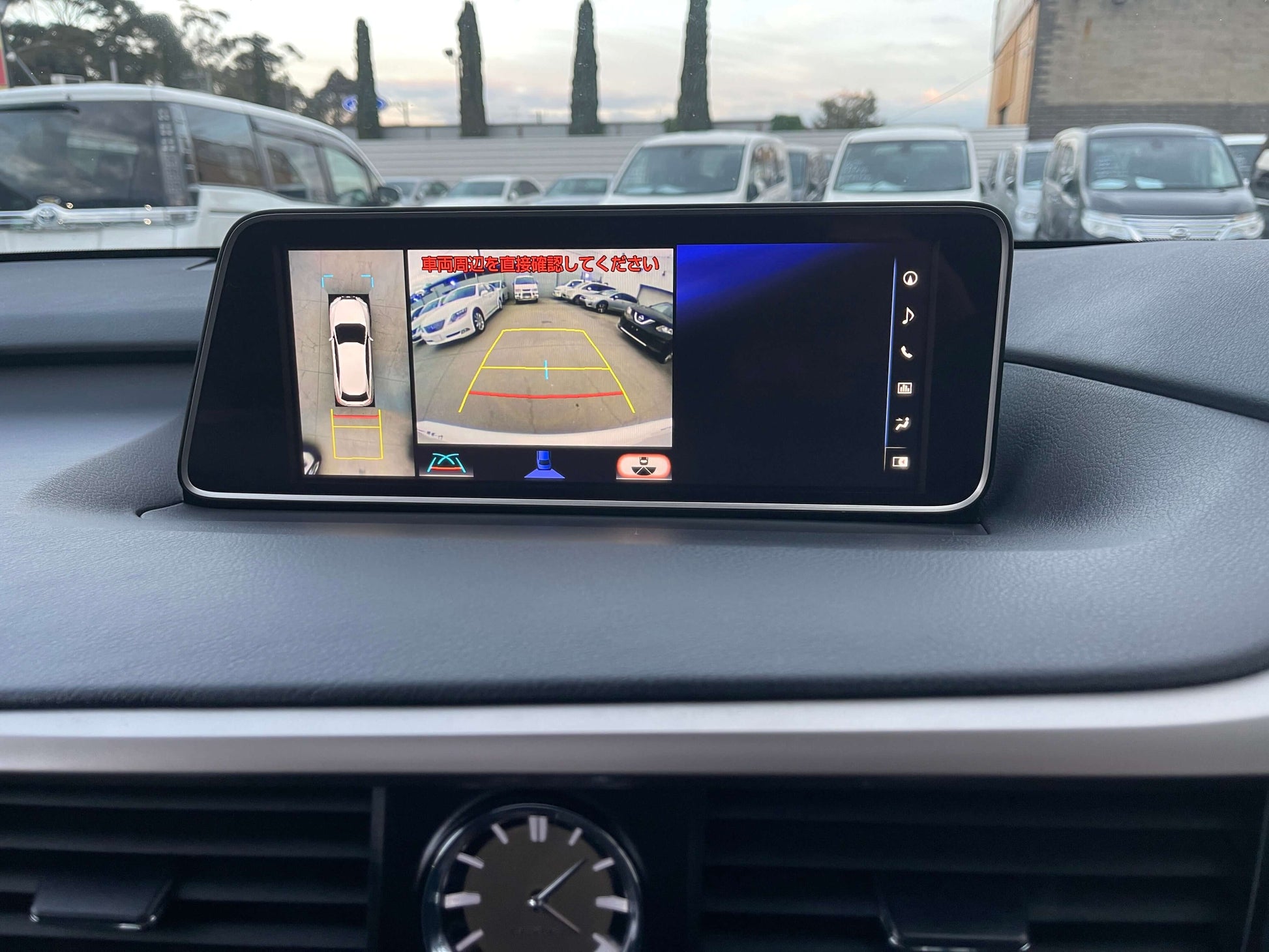 2017 Lexus RX450H hybrid SUV dashboard display showing rearview camera and parking assist features.