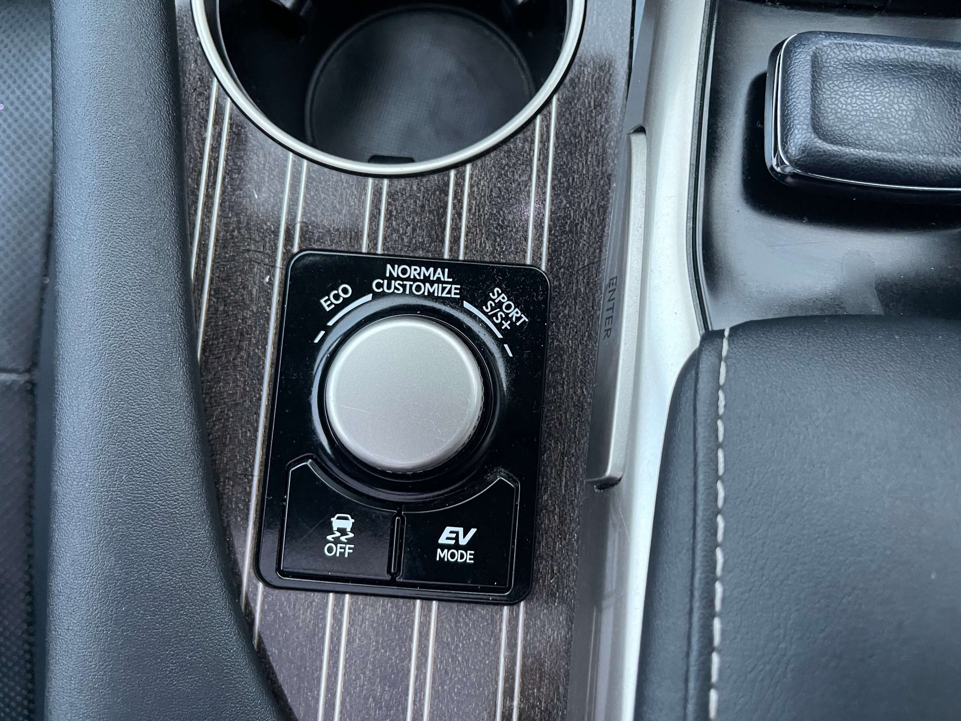 Interior controls of a 2017 Lexus RX450H hybrid SUV highlighting the drive mode options including ECO and EV Mode.