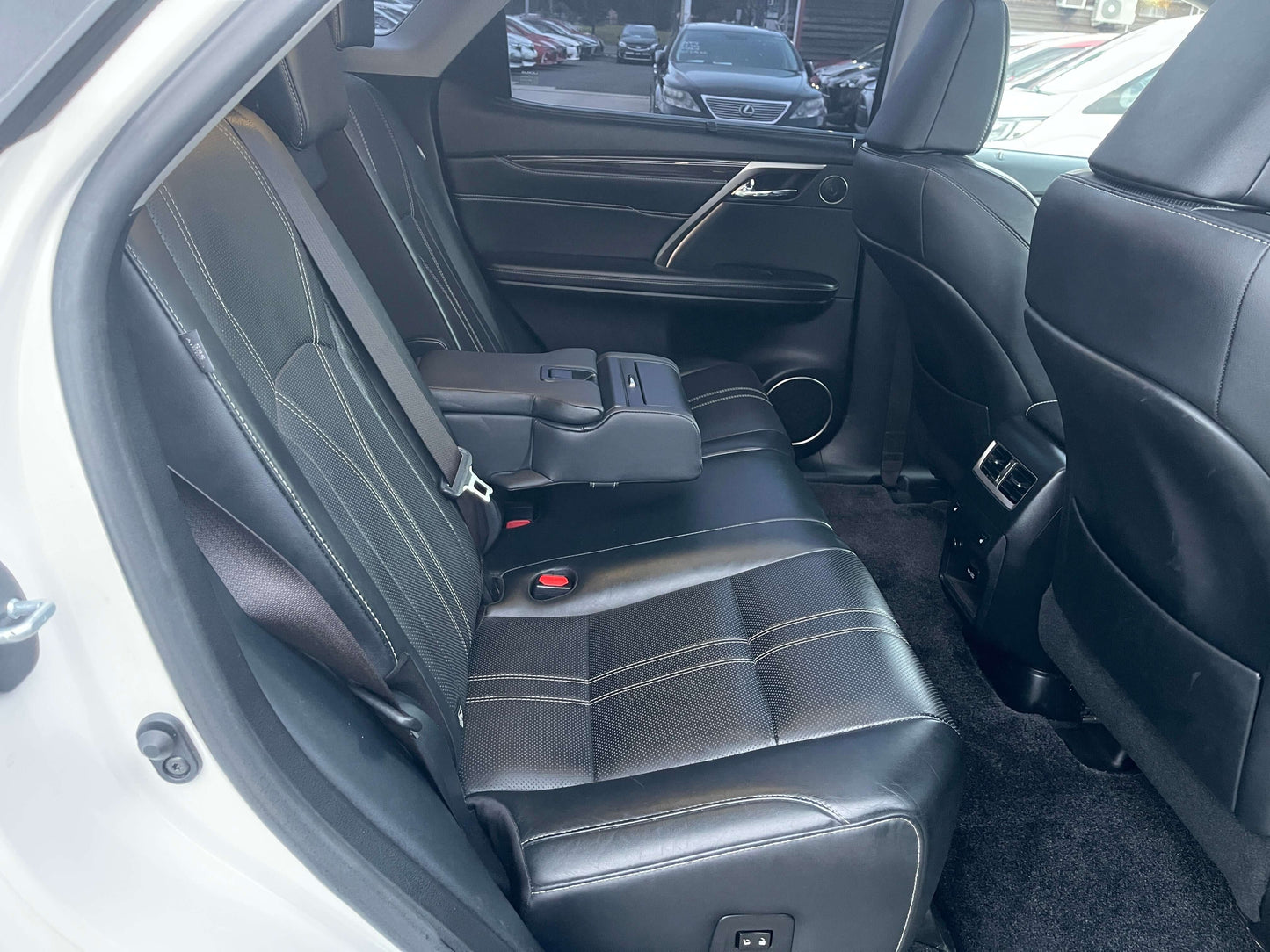 Interior view of the back seat of a 2017 Lexus RX450H V6 3.5L Hybrid L Version Luxury SUV, showcasing spacious and stylish seating.