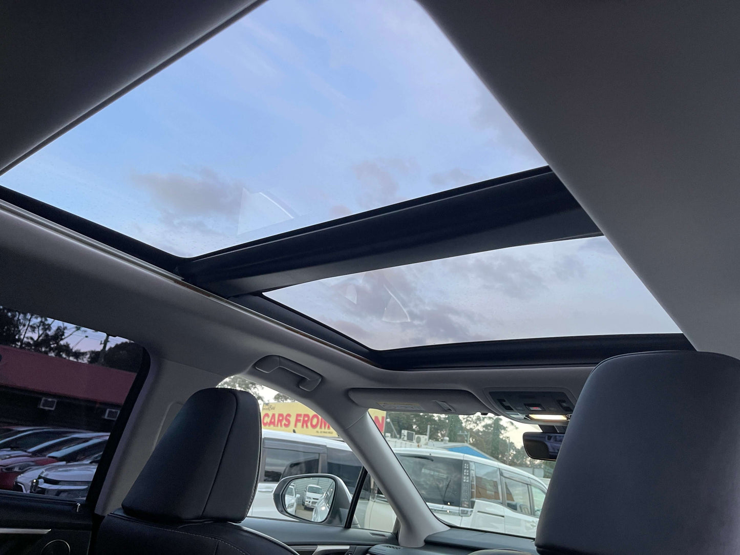 Interior view of the 2017 Lexus RX450H showing the skylite roof, enhancing the luxury SUV experience.