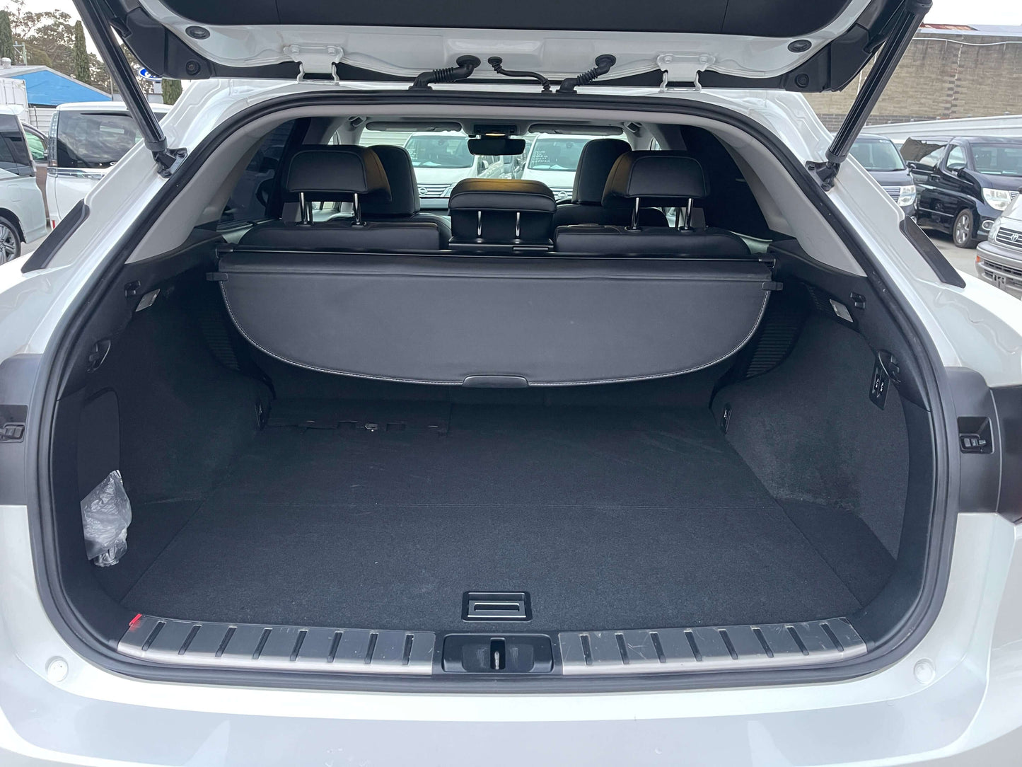 Spacious trunk interior of the 2017 Lexus RX450H V6 3.5L Hybrid L Version Luxury SUV, showcasing ample cargo space.