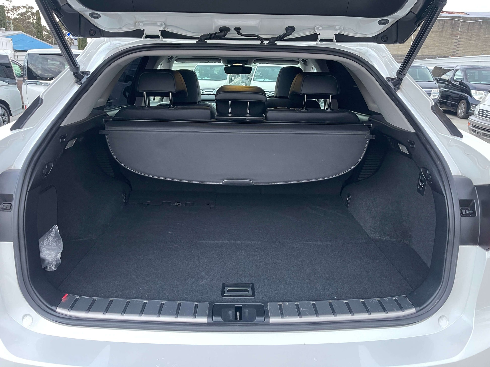 Spacious trunk interior of the 2017 Lexus RX450H V6 3.5L Hybrid L Version Luxury SUV, showcasing ample cargo space.