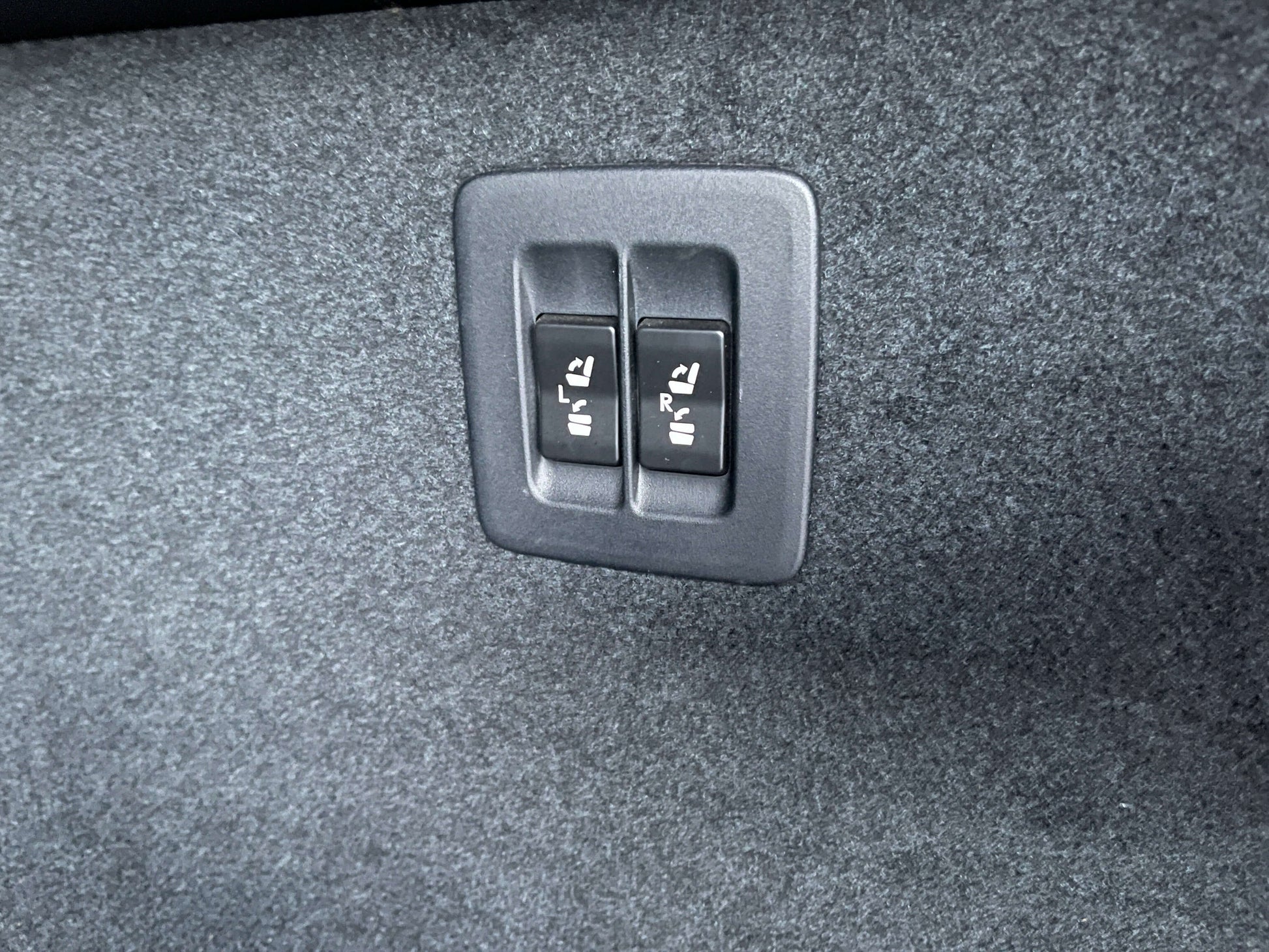 Buttons for power seat adjust in the 2017 Lexus RX450H hybrid SUV interior.