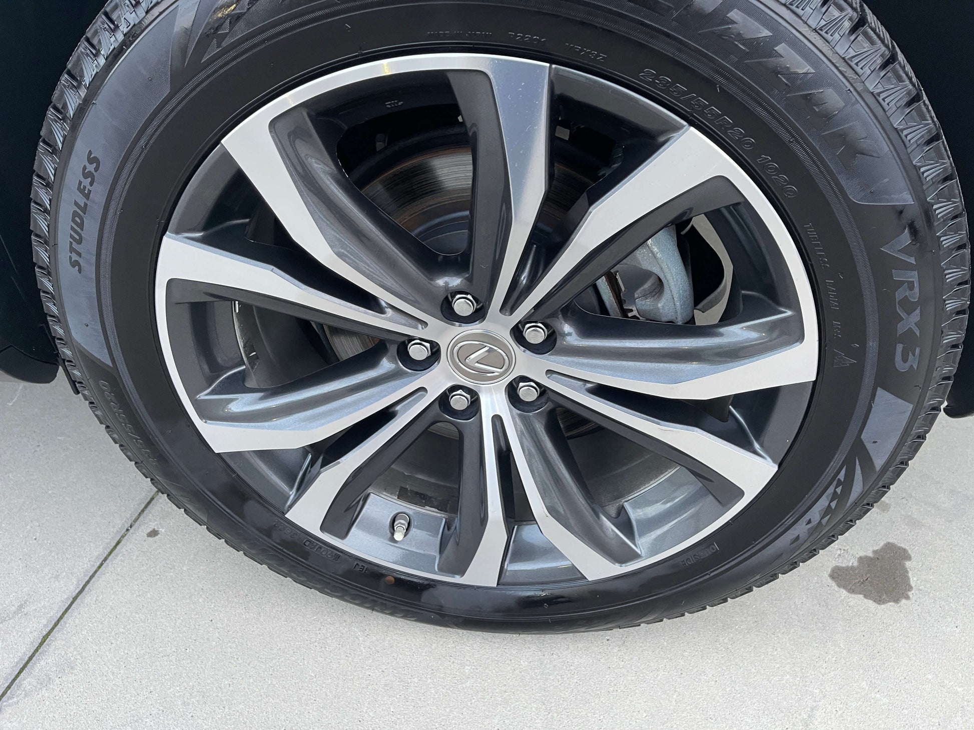 2017 Lexus RX450H luxury SUV wheel with chrome accents and VRX3 tire.