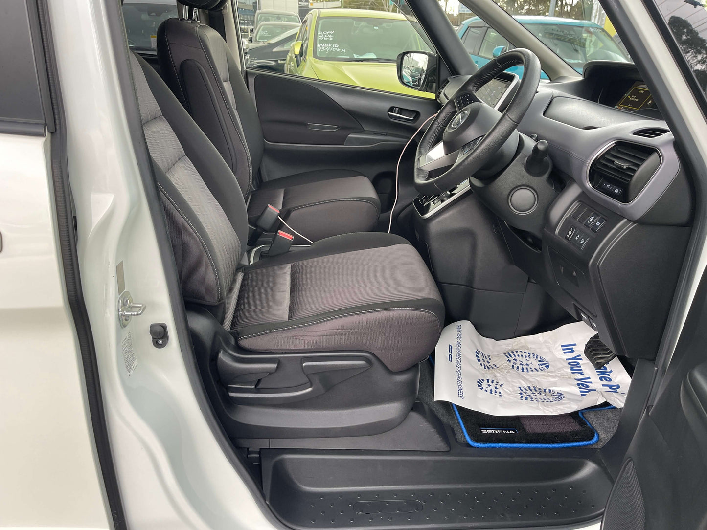 Interior view of 2020 Nissan Serena 1.2 e-Power with front seats and dashboard features.
