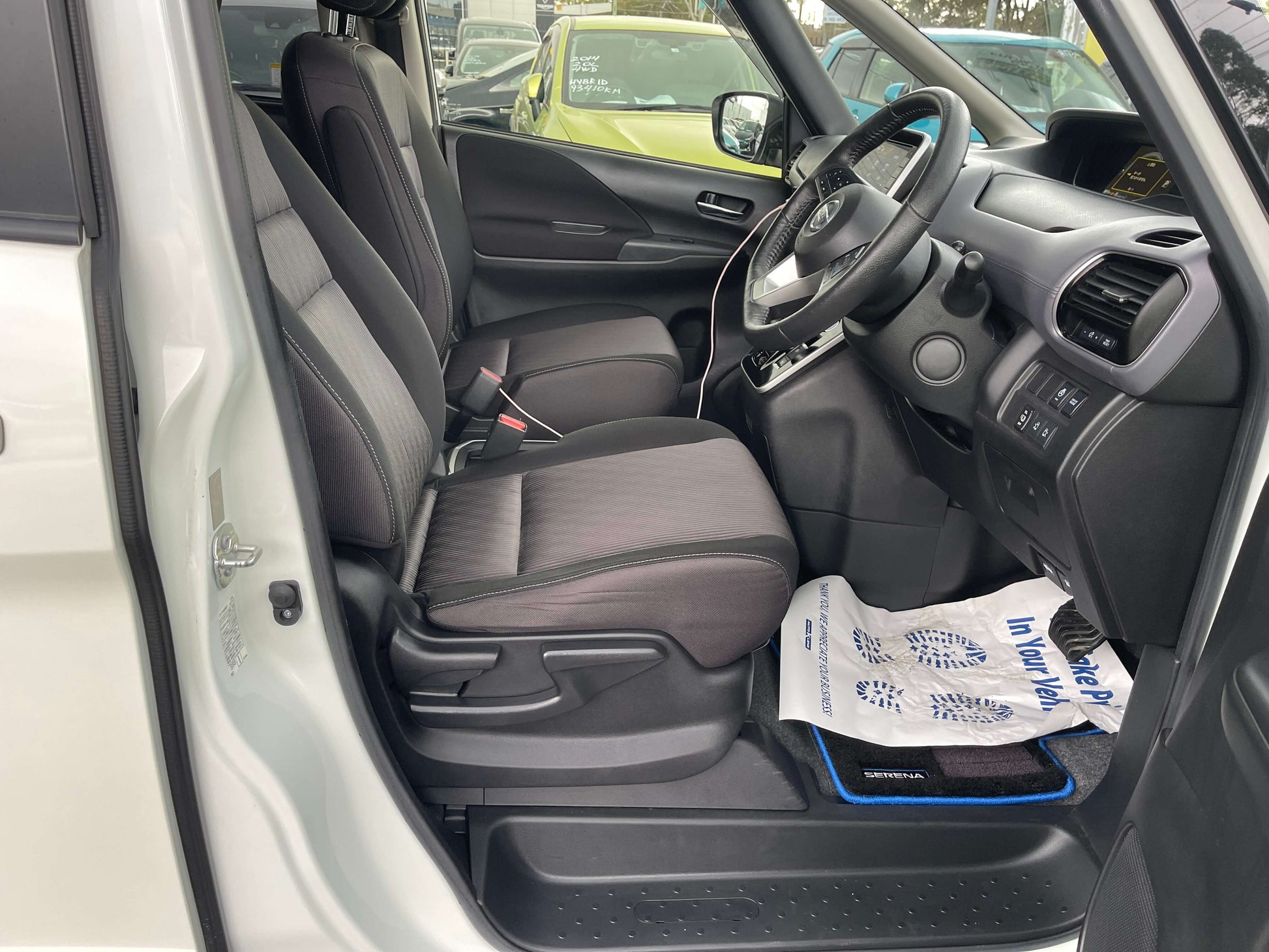 Interior view of 2020 Nissan Serena 1.2 e-Power with front seats and dashboard features.
