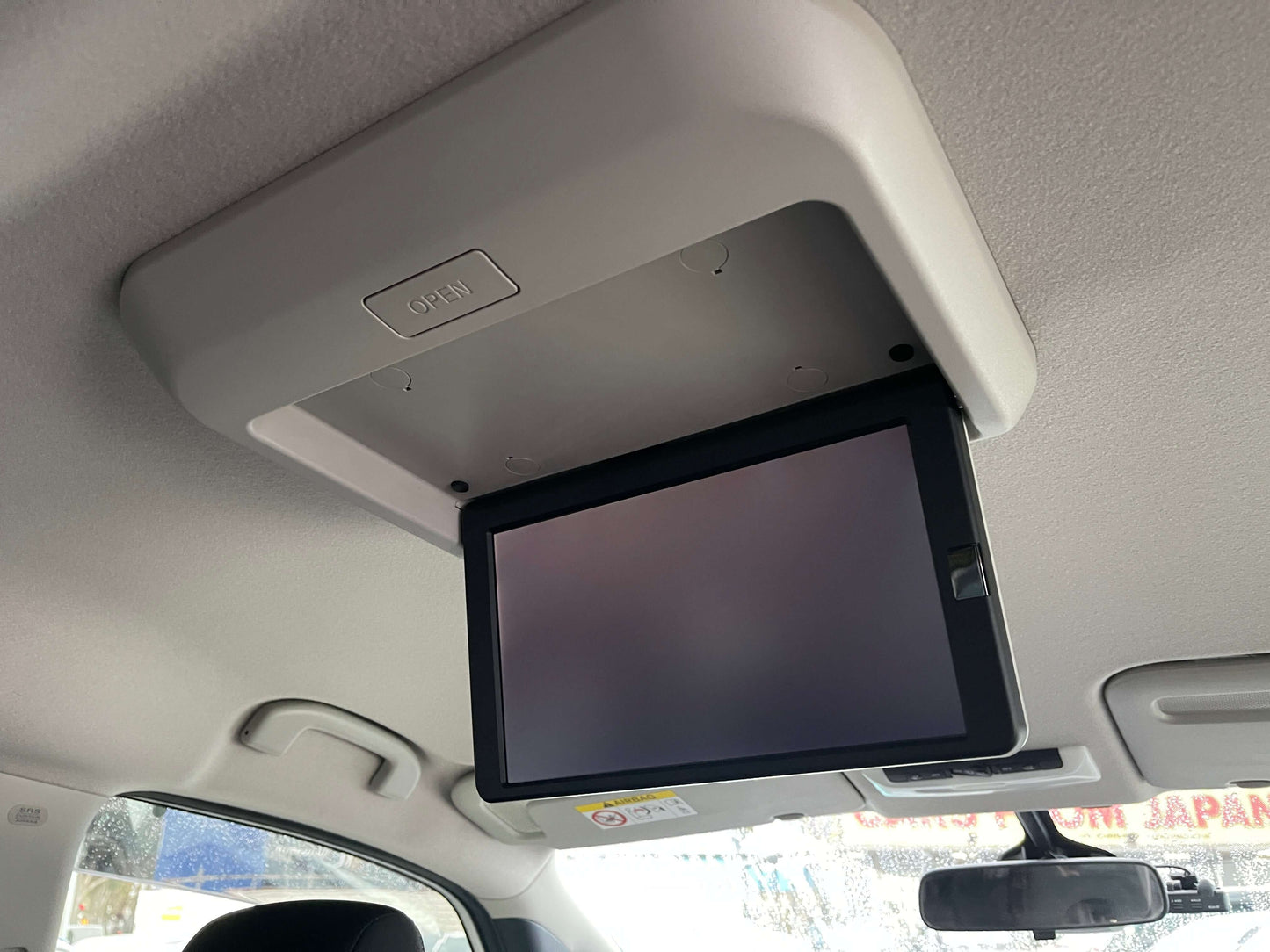 2020 Nissan Serena 1.2 e-Power rear ceiling-mounted entertainment screen for family trips.