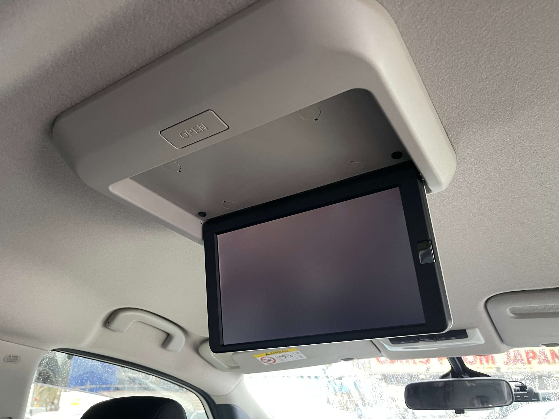2020 Nissan Serena 1.2 e-Power rear ceiling-mounted entertainment screen for family trips.
