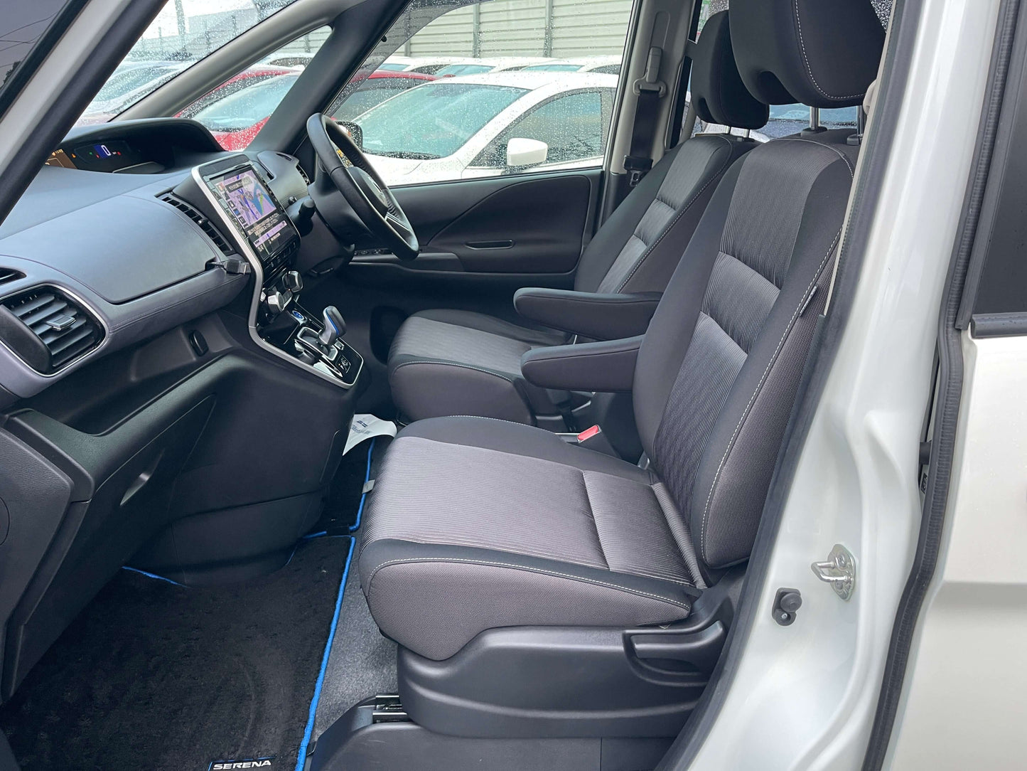 Interior view of 2020 Nissan Serena 1.2 e-Power Hybrid Highway Star V 7 seats showcasing front seats and dashboard.