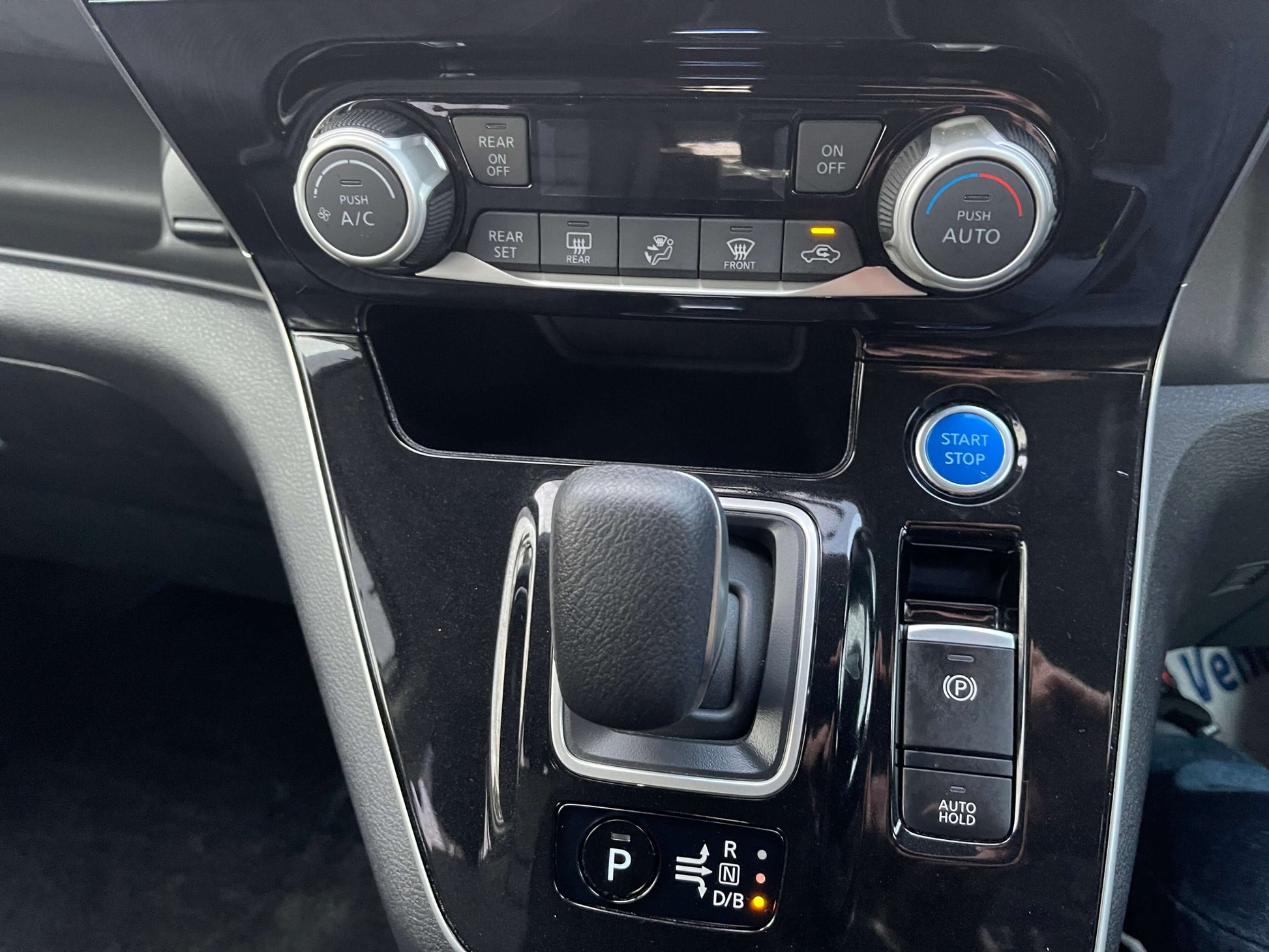 2020 Nissan Serena 1.2 e-Power interior dashboard controls including gear shift and climate controls.