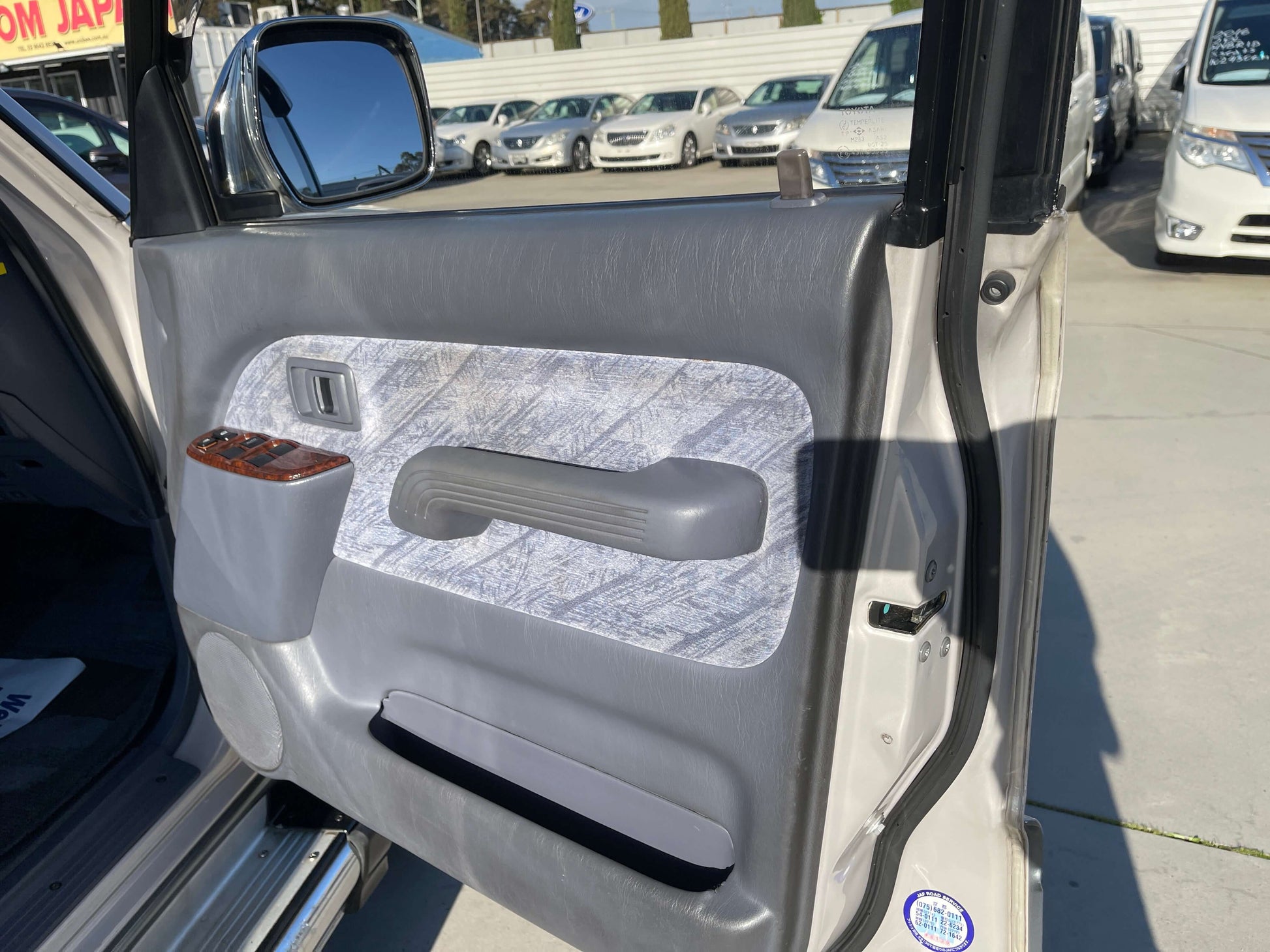 Interior view of 1996 Toyota Land Cruiser Prado V6 3.4L door panel, showcasing design and features.