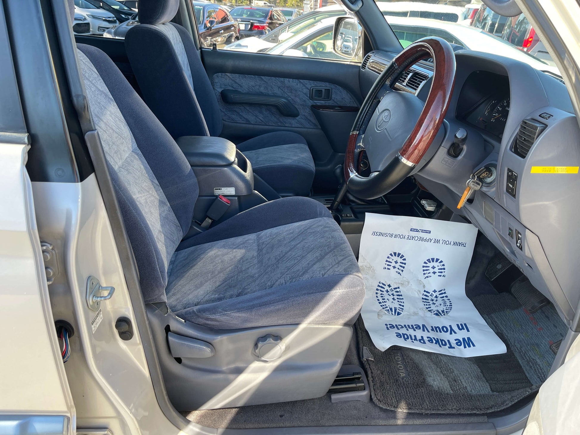 Interior view of 1996 Toyota Land Cruiser Prado V6 3.4L showing front seats and dashboard.