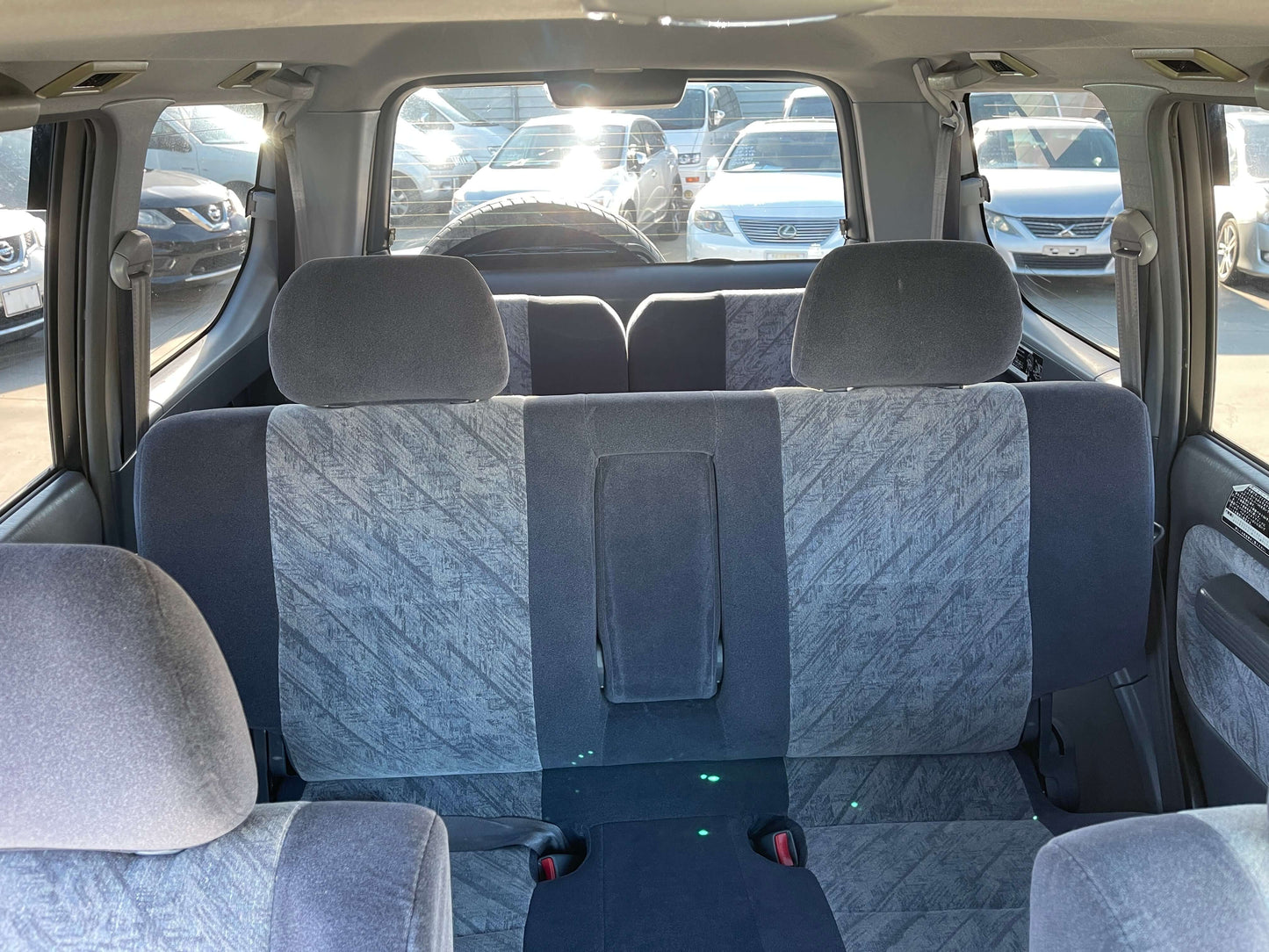 Interior view of the back seats of a 1996 Toyota Land Cruiser Prado V6 3.4L TZ, featuring spacious 8-seat arrangement.