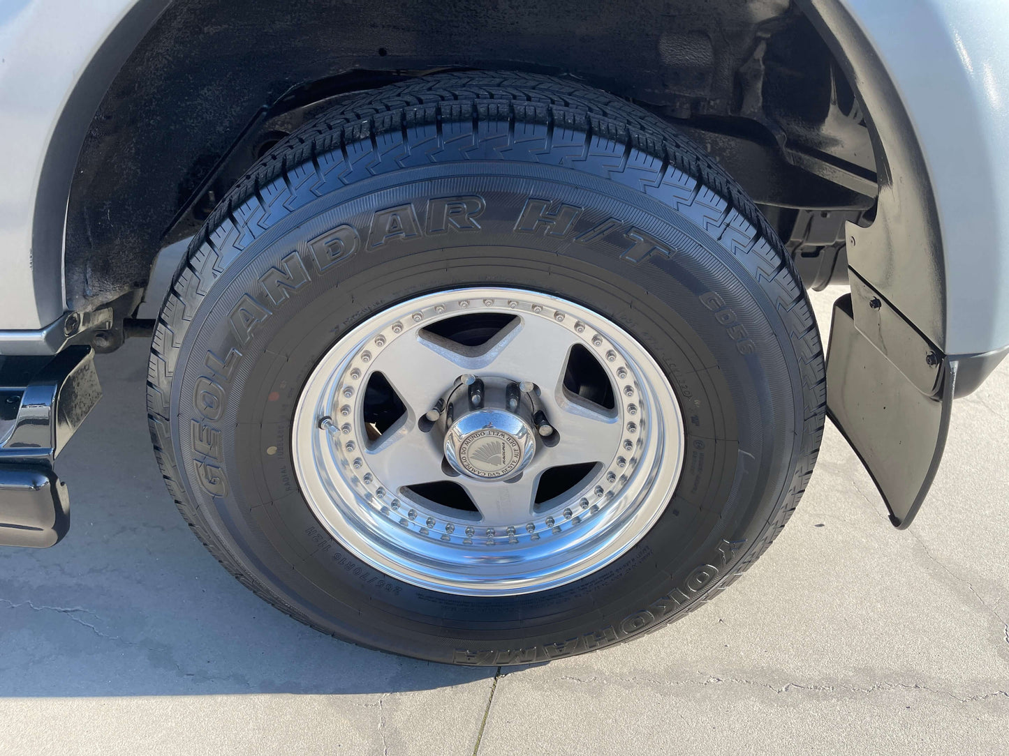 Wheel and tire of a 1996 Toyota Land Cruiser Prado V6 3.4L showcasing rugged design and durability.
