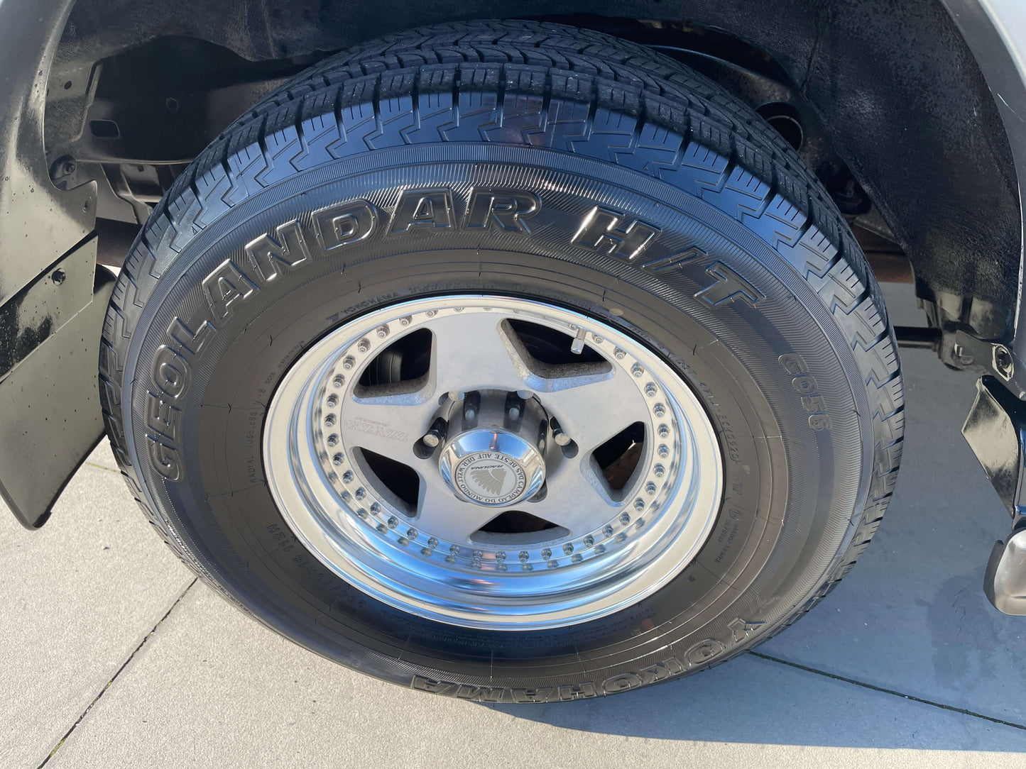 Close-up of tire on 1996 Toyota Land Cruiser Prado V6 3.4L, showcasing the wheel and tread pattern.