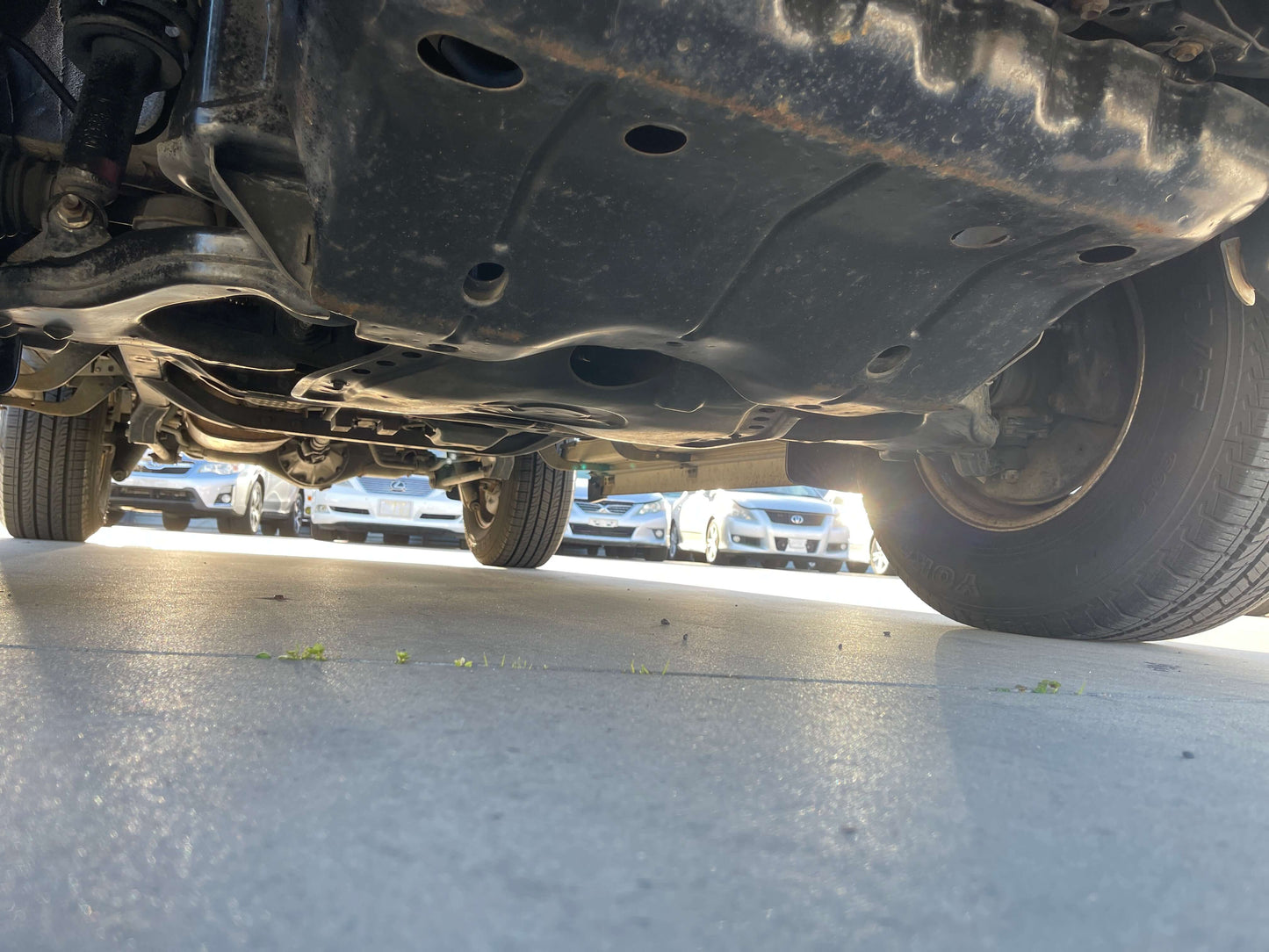 Undercarriage view of a 1996 Toyota Land Cruiser Prado V6 3.4L showing 4WD components and vehicle structure.