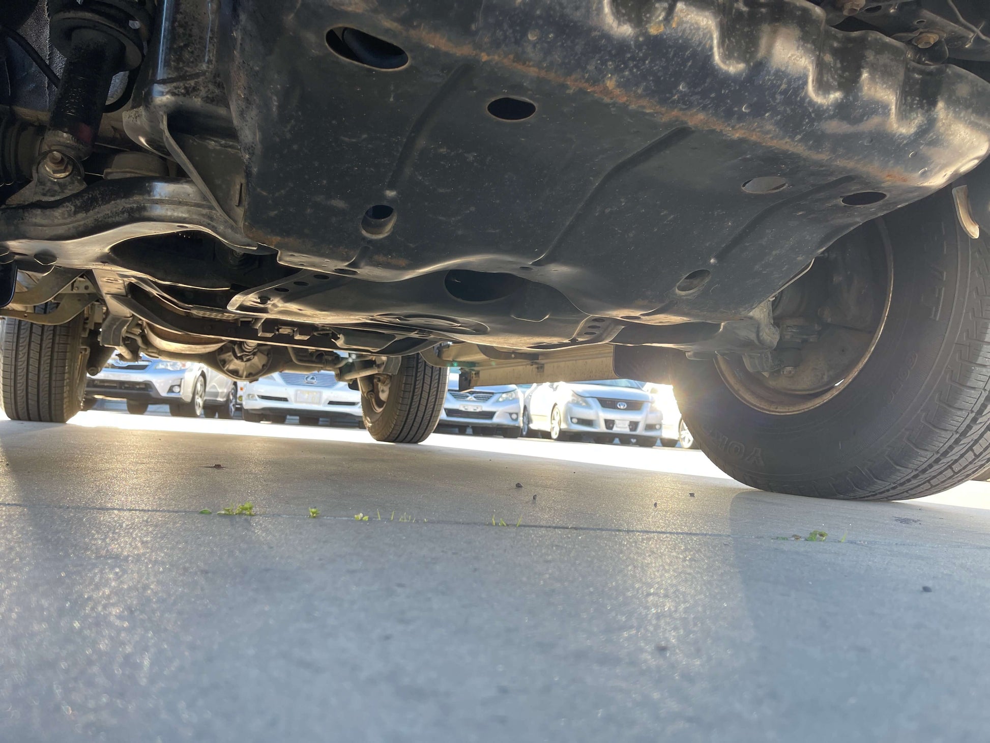 Undercarriage view of a 1996 Toyota Land Cruiser Prado V6 3.4L showing 4WD components and vehicle structure.