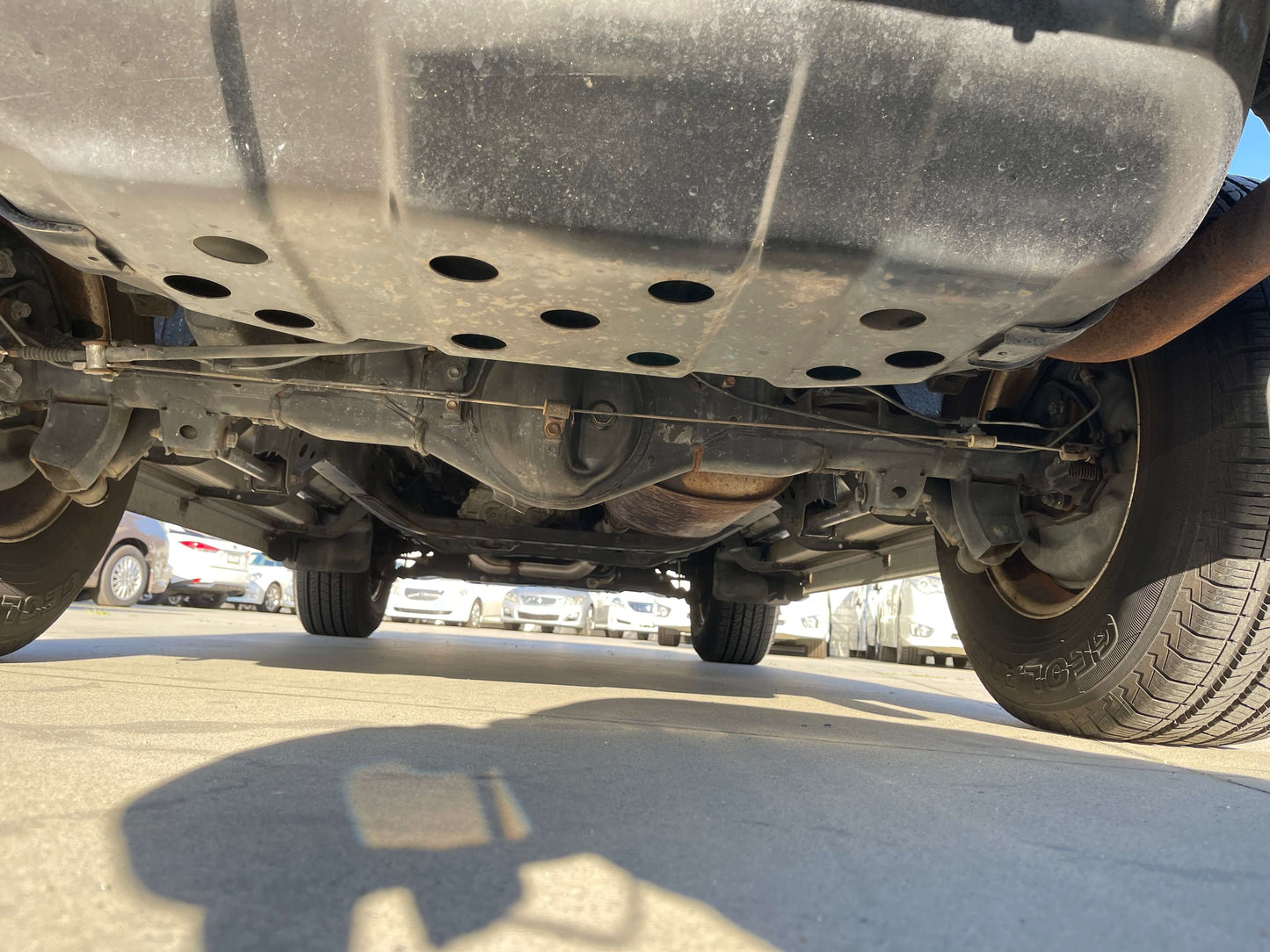 Underneath view of a 1996 Toyota Land Cruiser Prado V6 3.4L showing chassis and suspension details.