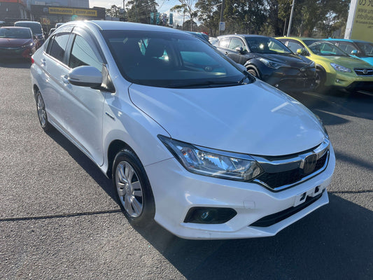 2019 Honda Grace 1.5 Hybrid LX Sedan, white exterior, parked in a lot, showcasing its sporty design and modern features.