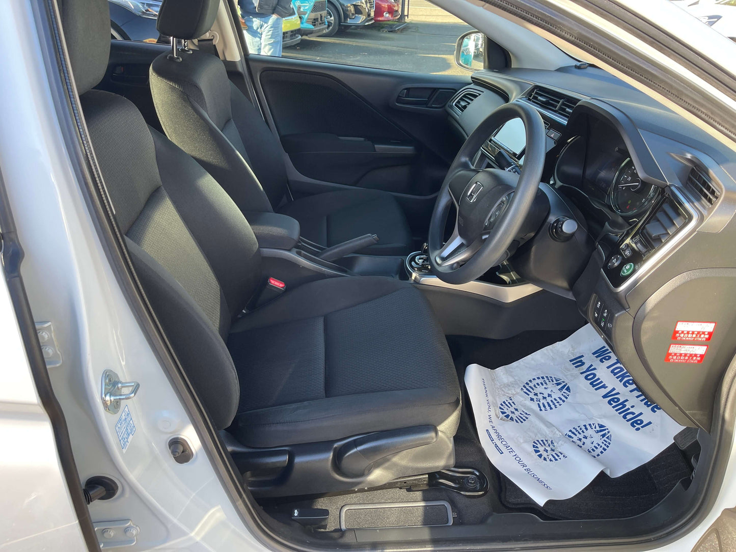 Interior view of 2019 Honda Grace 1.5 Hybrid LX Sedan, showcasing seats and dashboard design.