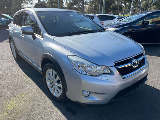 2014 Subaru XV Hybrid 2.0i-L EyeSight 4WD in silver color parked outdoors with clear view of front and side.