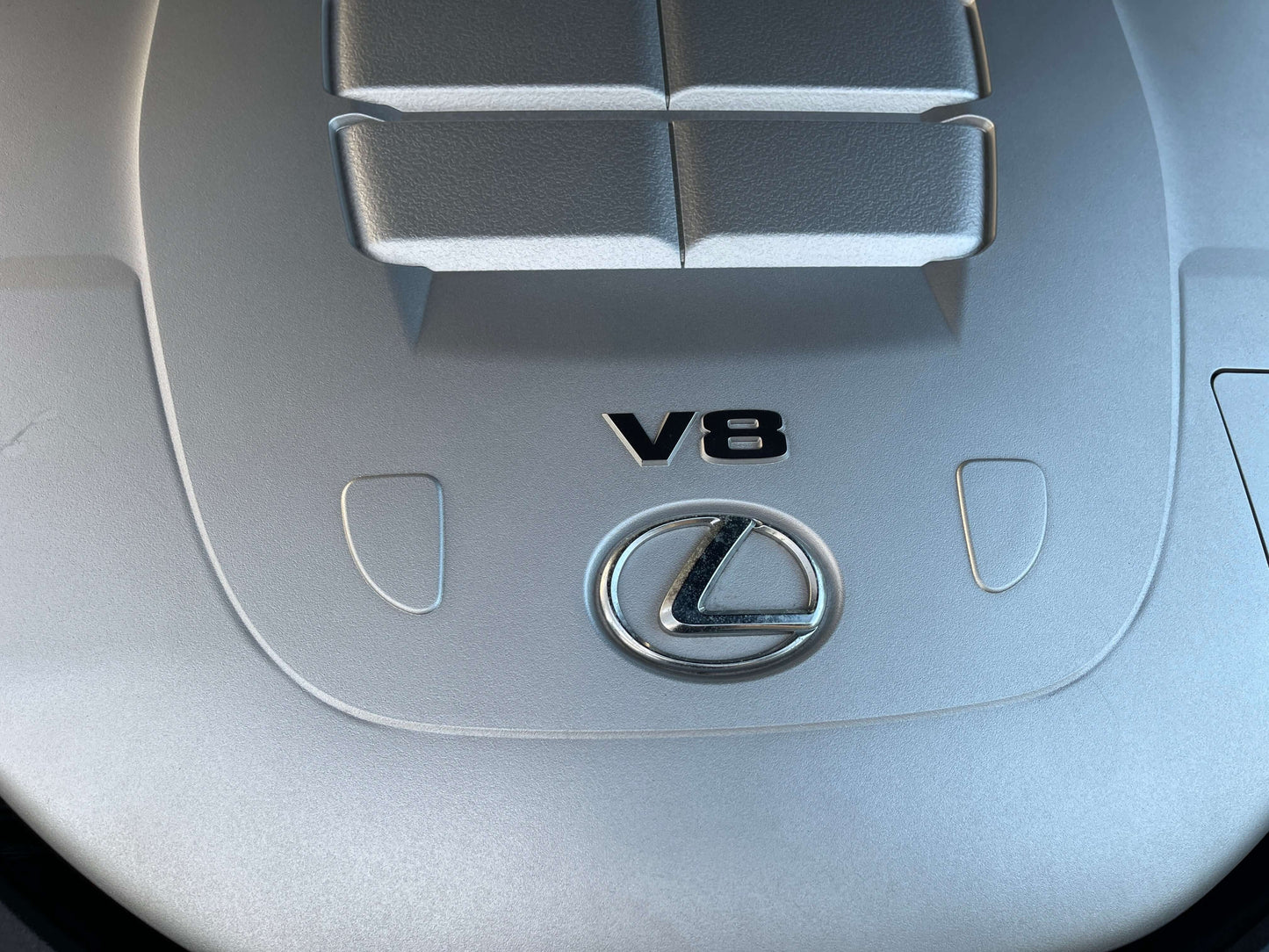 2010 Lexus LS460 AWD V8 engine cover with Lexus logo and V8 emblem, showcasing premium luxury vehicle specifications.