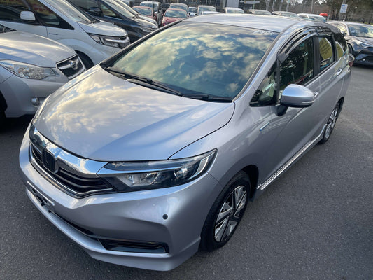 2019 Honda Shuttle 1.5 Hybrid X Honda Sensing Edition 5 seater in silver color parked with other cars.