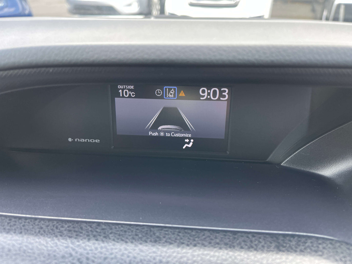 Dashboard display of the 2018 Toyota Noah 1.8L Hybrid showing time and outside temperature.