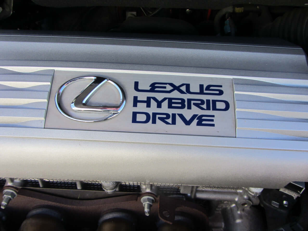 Lexus Hybrid Drive engine badge featured in the 2010 Lexus HS250H 2.4L Hybrid Luxury Sedan.