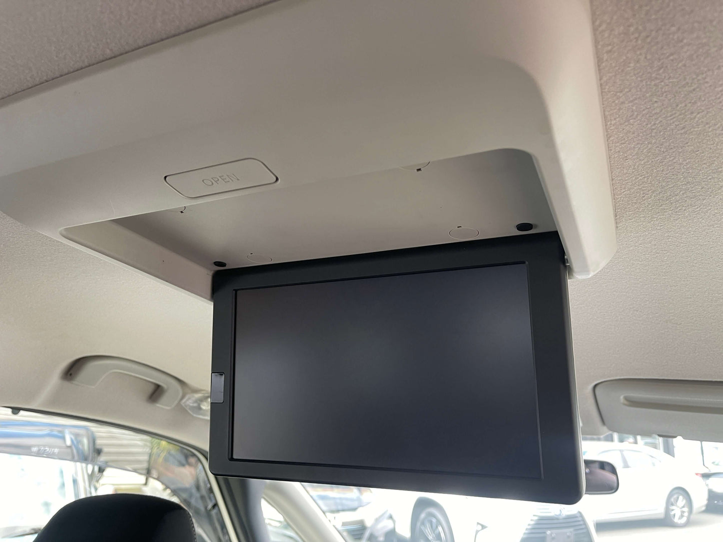 Interior overhead screen in a 2016 Nissan Serena for entertainment and convenience.