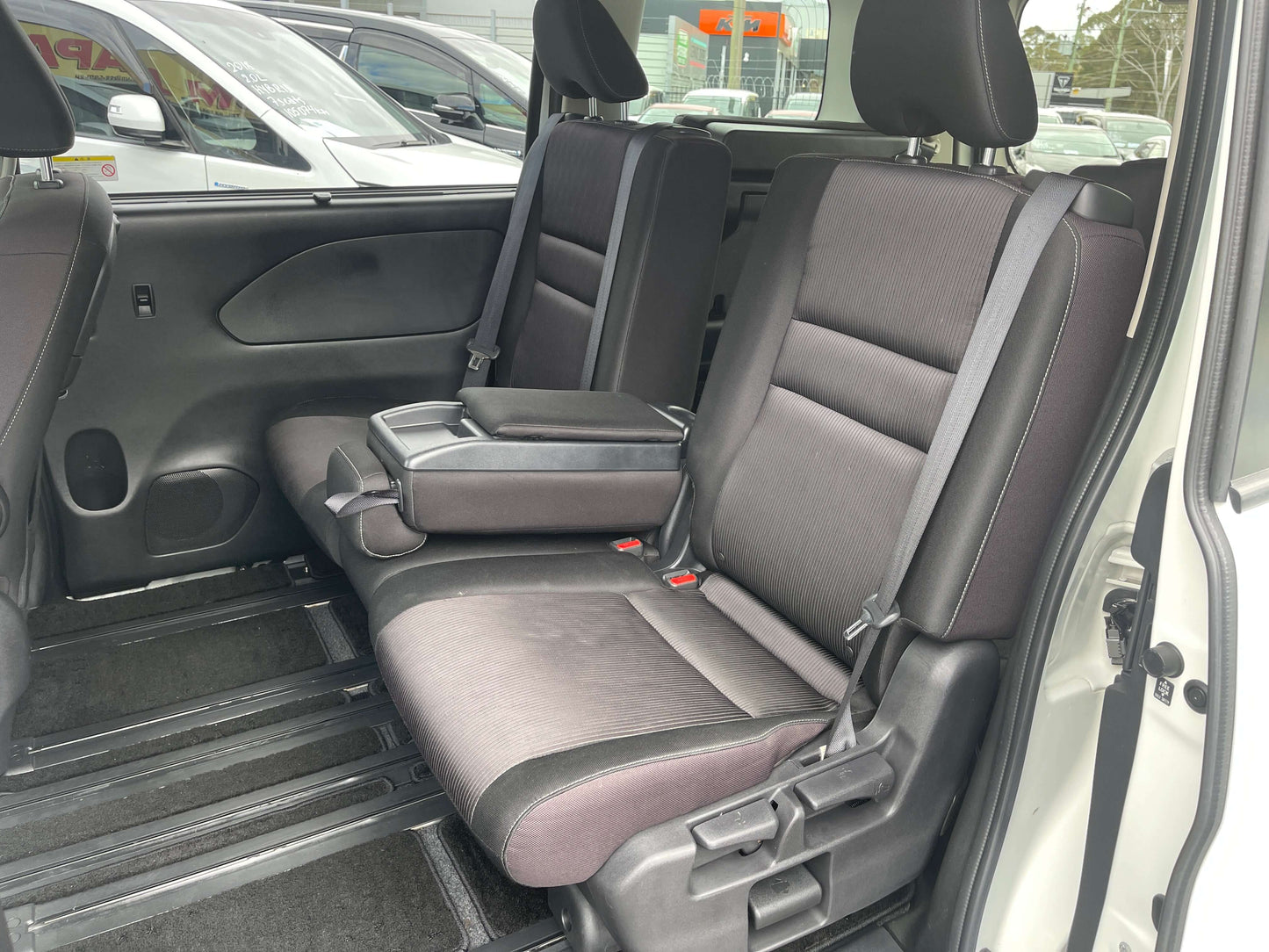 Interior view of the rear seating in a 2016 Nissan Serena 2.0L S-Hybrid Highway Star G Edition with 8 seats.