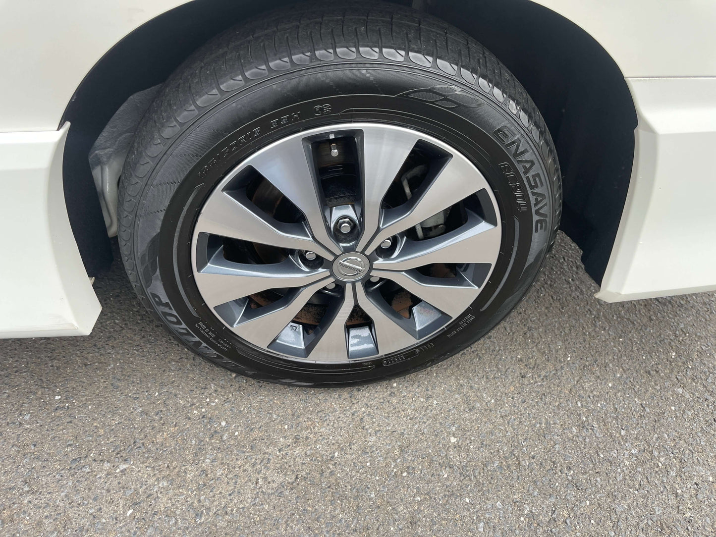 Close-up view of a 2016 Nissan Serena wheel and tire showcasing the stylish alloy design.