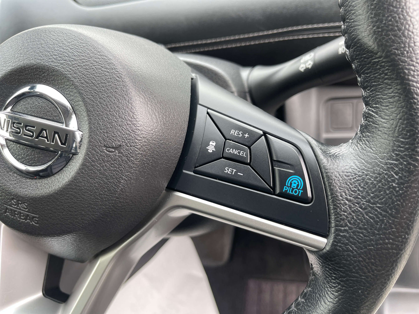 2016 Nissan Serena steering wheel with ProPilot controls and buttons for cruise control settings, interior close-up