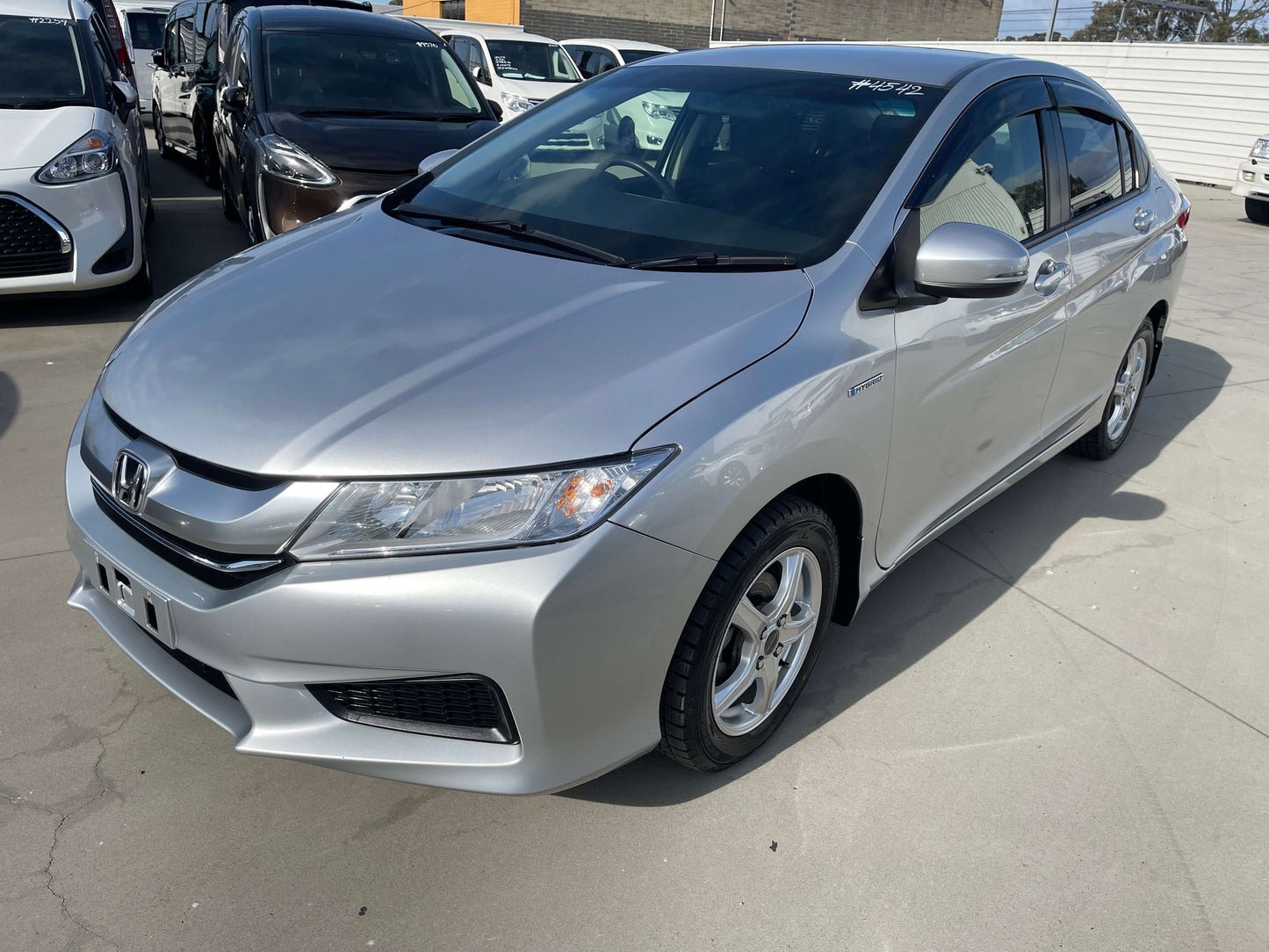 2015 Honda Grace 1.5 Hybrid DX Sedan in silver color with efficient fuel economy and 5 seating capacity.