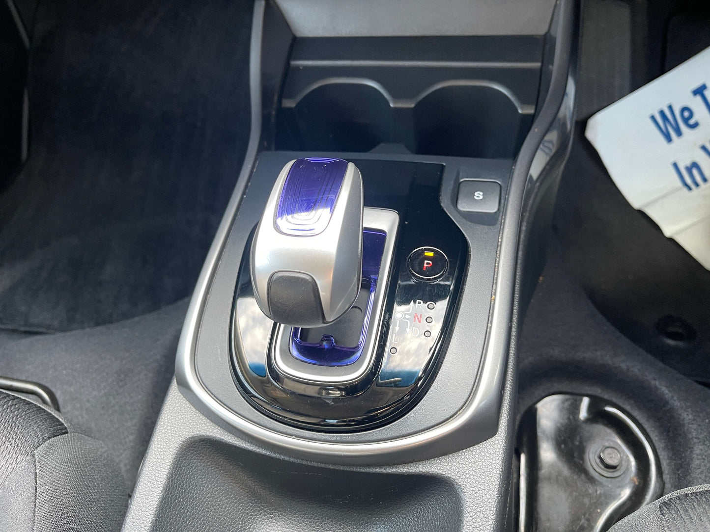 Interior gearshift of a 2015 Honda Grace 1.5 Hybrid DX Sedan with modern design and controls.