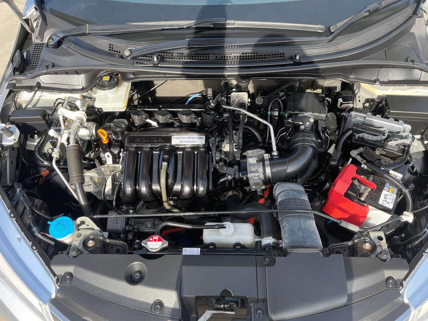 2015 Honda Grace 1.5 Hybrid engine compartment with hybrid technology components visible in a compact sedan.