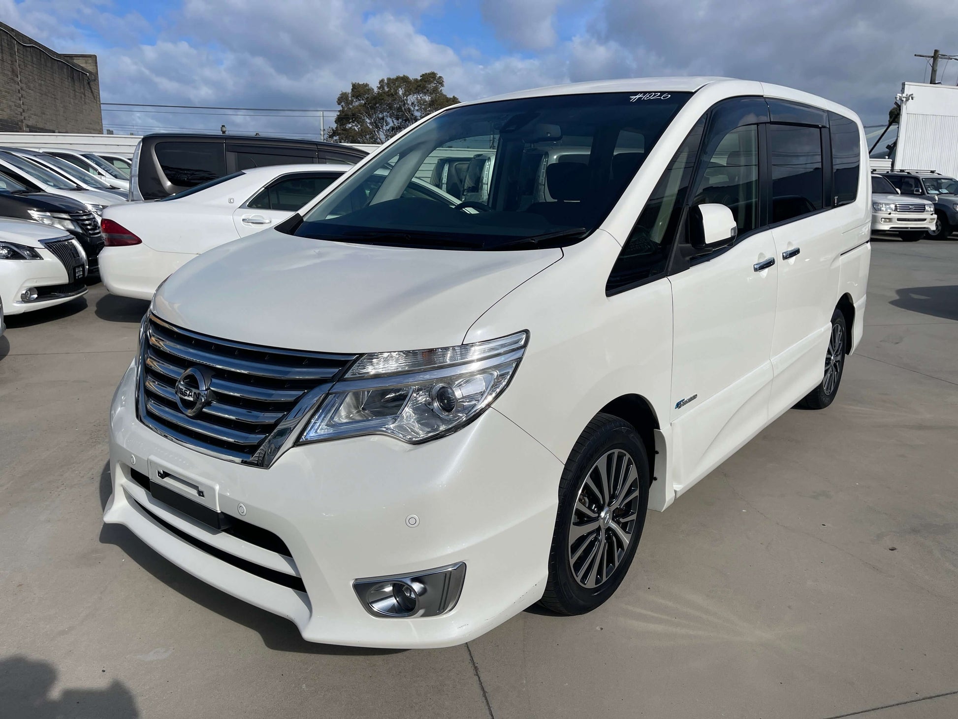 2016 Nissan Serena 2.0L S-Hybrid Highway Star in white, showcasing modern design and spacious seating.