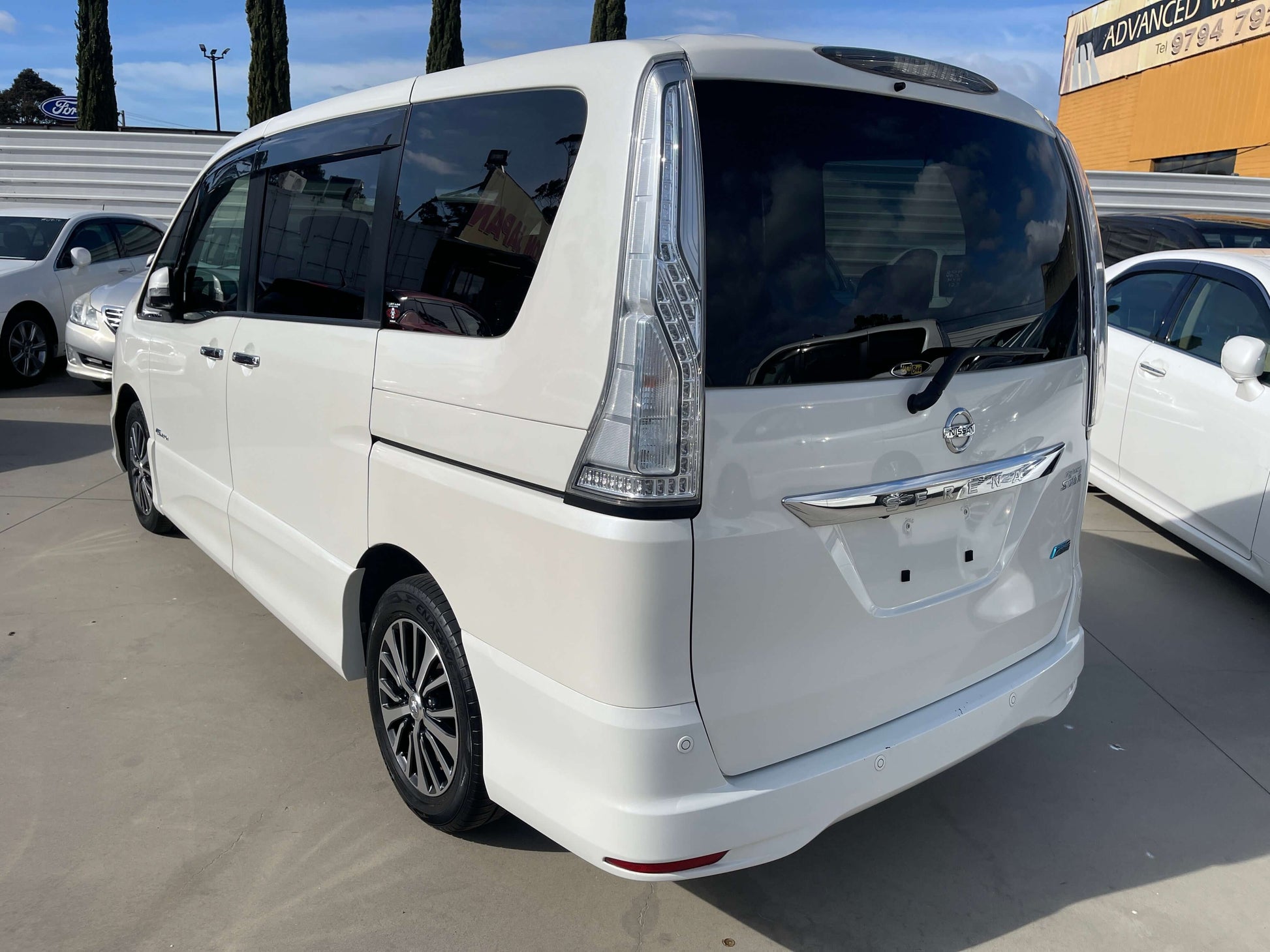 2016 Nissan Serena rear view, spacious family MPV, 8-seater with hybrid technology, in white color.