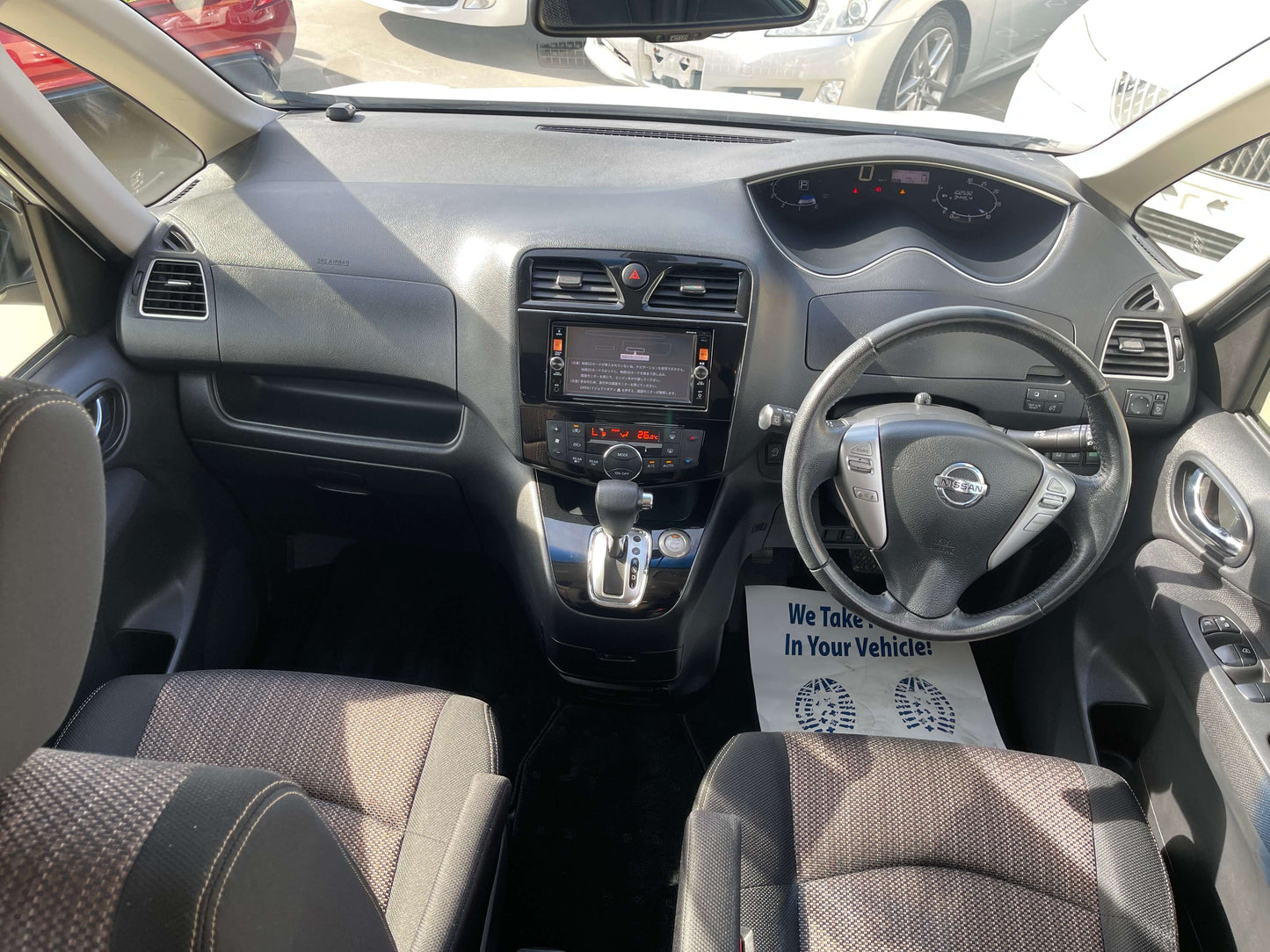 Interior view of a 2016 Nissan Serena 2.0L S-Hybrid Highway Star showcasing dashboard and seating layout.