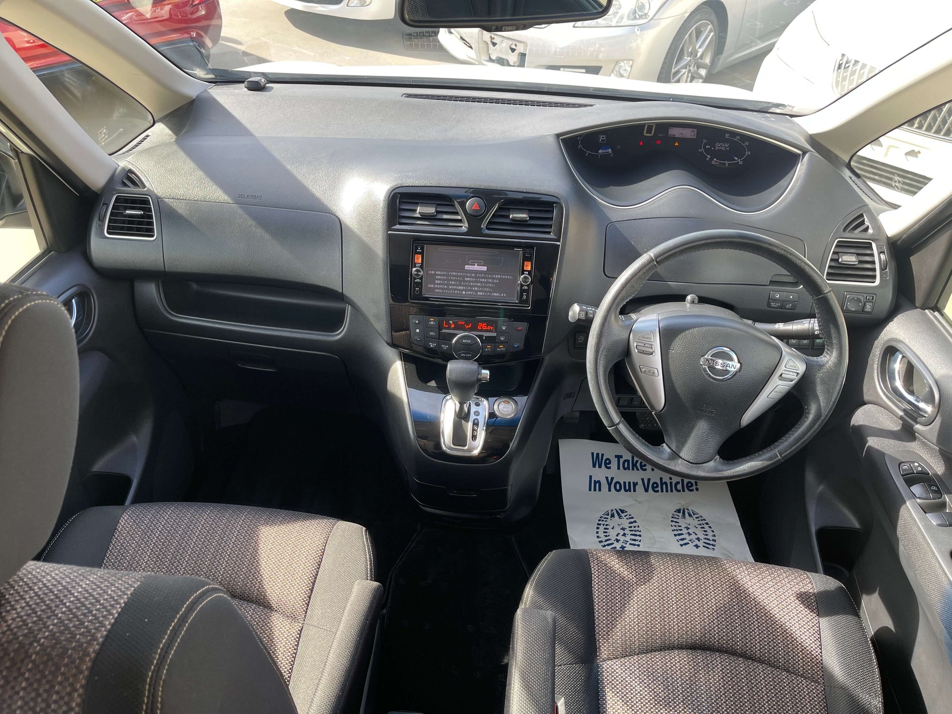 Interior view of a 2016 Nissan Serena 2.0L S-Hybrid Highway Star showcasing dashboard and seating layout.