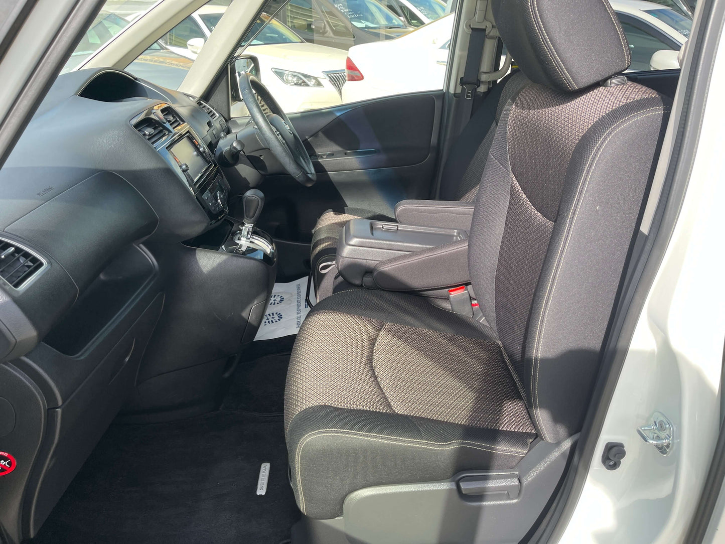 Interior of 2016 Nissan Serena 2.0L S-Hybrid Highway Star, featuring spacious seating and modern dashboard design.