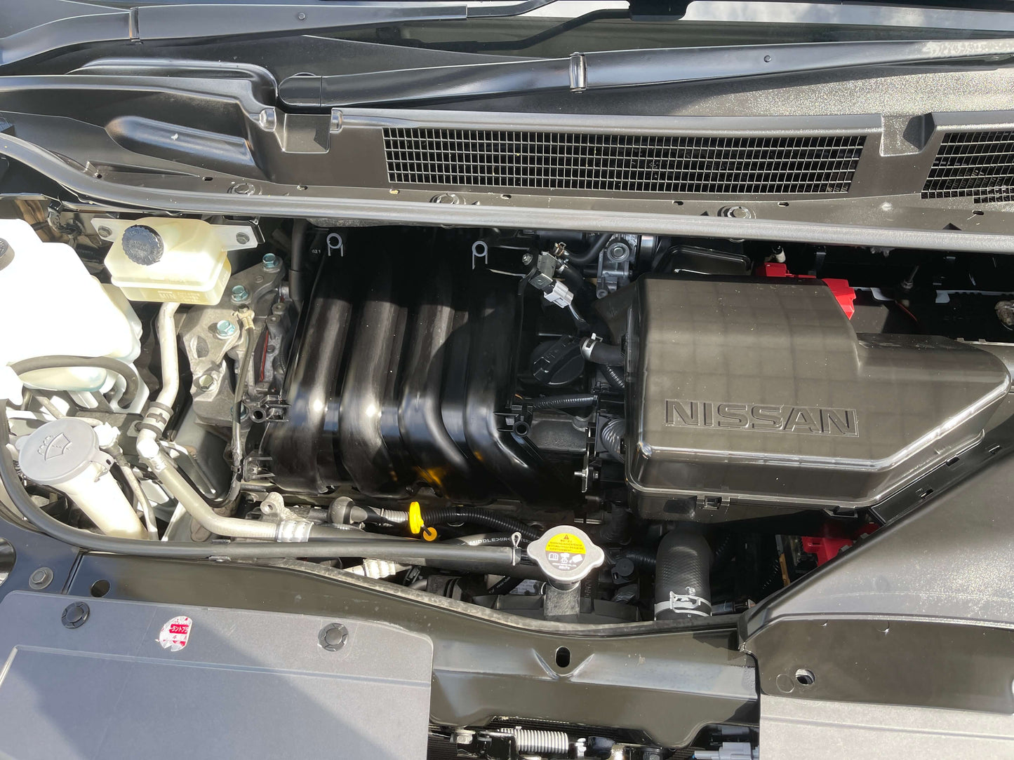 2016 Nissan Serena engine compartment showcasing the 2.0L S-Hybrid powertrain components.